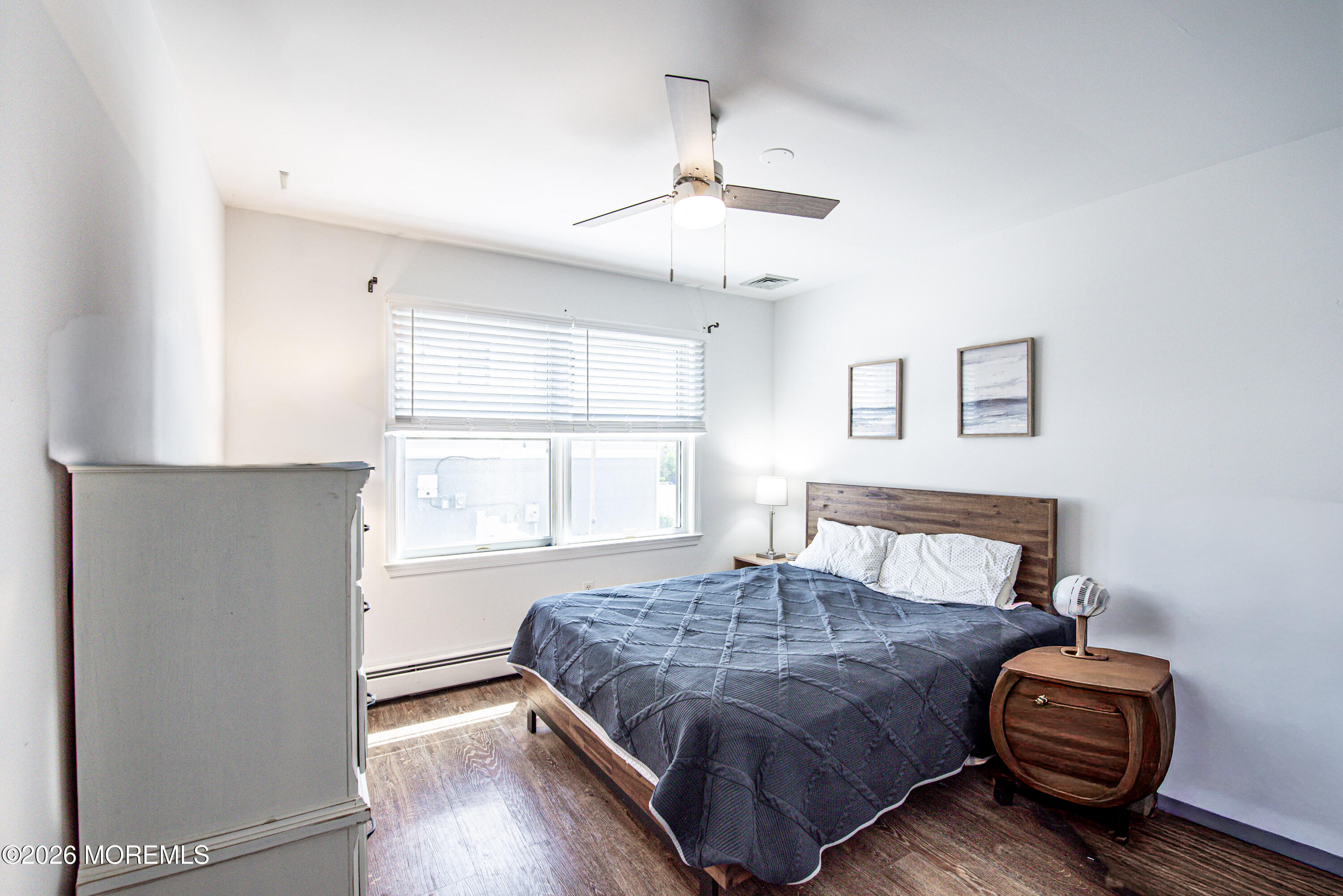5 A Sunset Boulevard Barnegat Light, NJ 08006 - Photo 31 of 65 a bedroom with a bed and window
