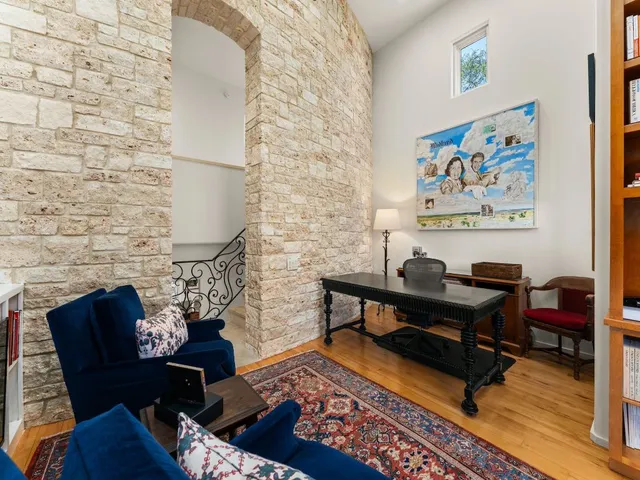 a living room with furniture and a rug