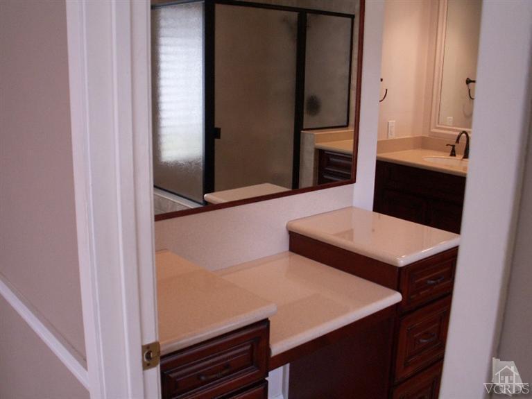 4280 Springfield Street Simi Valley, CA 93063 - Photo 22 of 34 a bathroom with a sink and a mirror