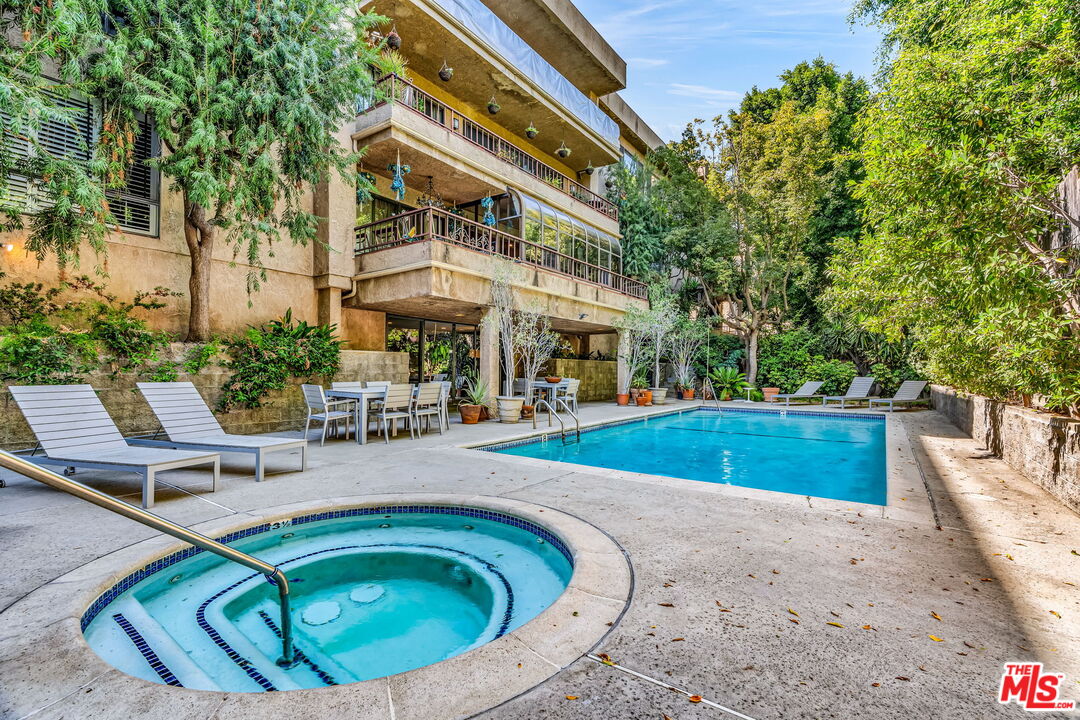 1124 North Kings Road, Unit 102 West Hollywood, CA 90069 - Photo 16 of 26 a view of outdoor space yard swimming pool and patio