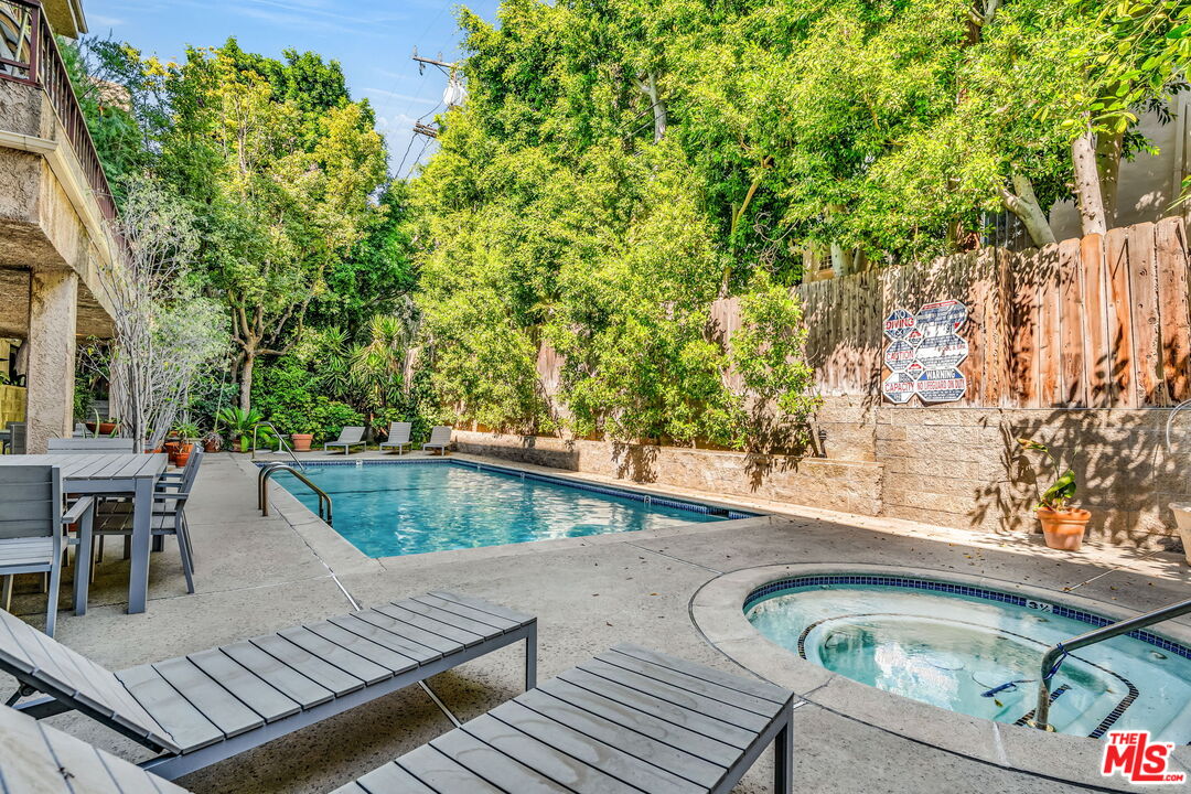 1124 North Kings Road, Unit 102 West Hollywood, CA 90069 - Photo 17 of 26 swimming pool view with a seating space