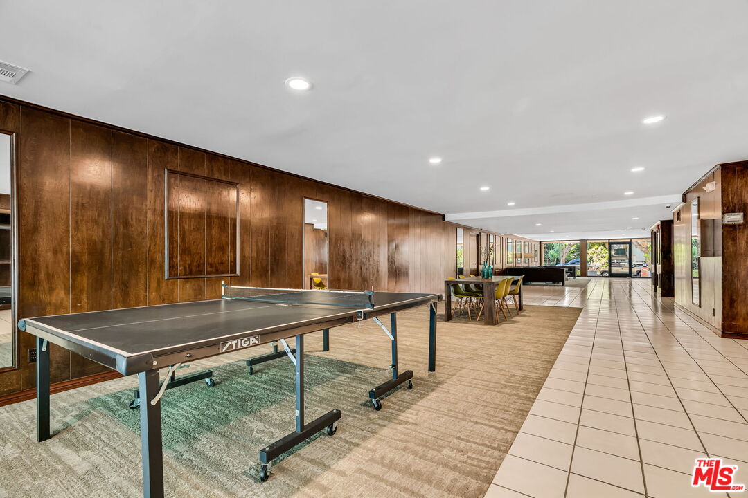 1124 North Kings Road, Unit 102 West Hollywood, CA 90069 - Photo 21 of 26 a lobby with furniture and lots of wooden floor