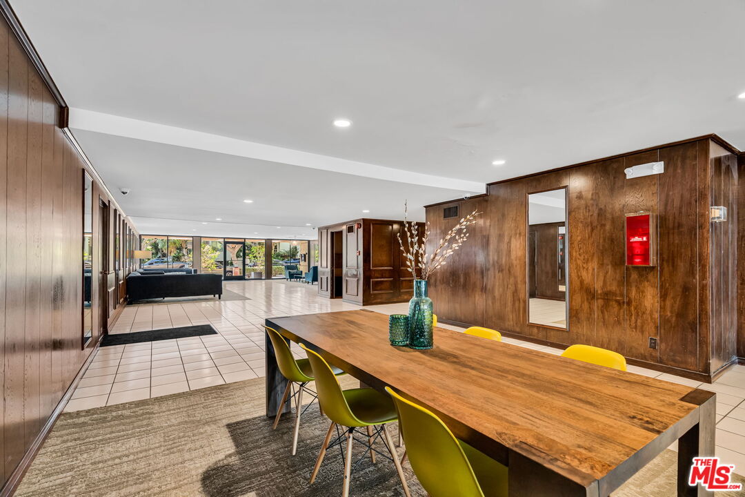 1124 North Kings Road, Unit 102 West Hollywood, CA 90069 - Photo 22 of 26 a view of a dining room with furniture