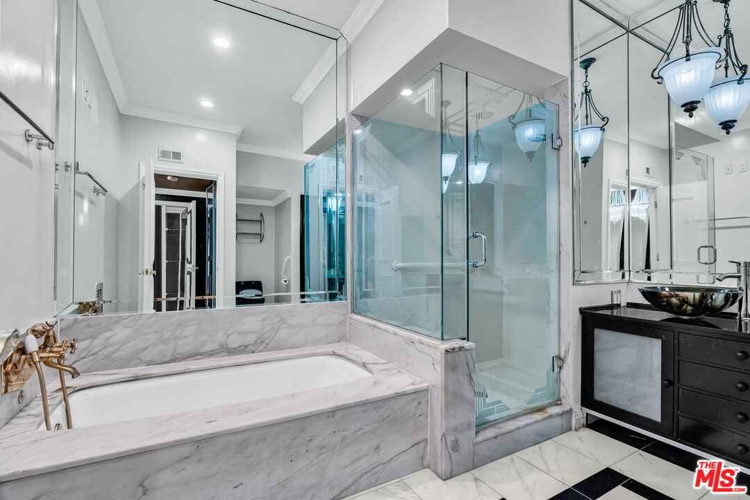 1124 North Kings Road, Unit 102 West Hollywood, CA 90069 - Photo 6 of 26 a bathroom with a granite countertop sink a mirror and shower