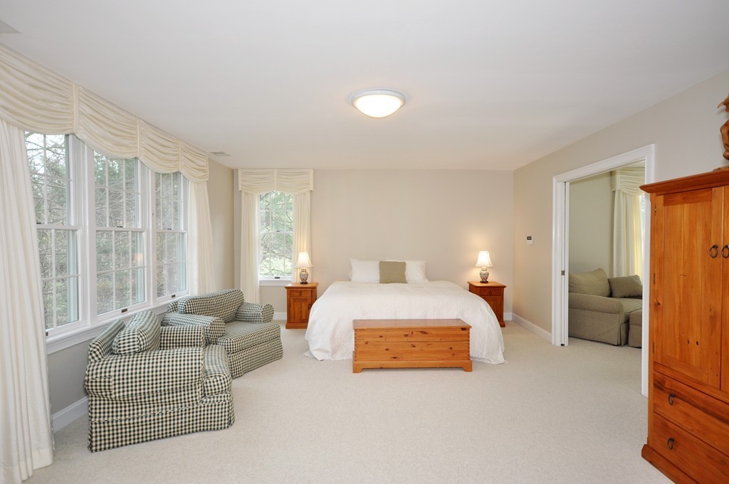 75 Channing Road Concord, MA 01742 - Photo 11 of 19 a spacious bedroom with a bed and a couch