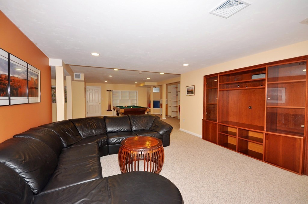 75 Channing Road Concord, MA 01742 - Photo 15 of 19 a living room with furniture a wooden floor and a window