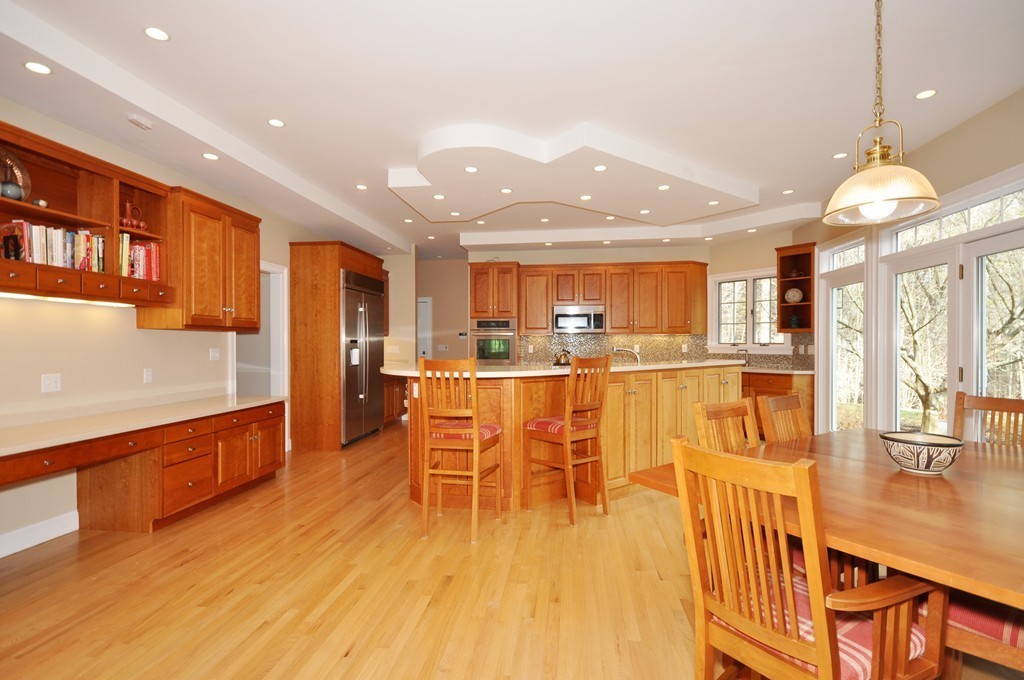 75 Channing Road Concord, MA 01742 - Photo 5 of 19 a dining room with furniture a kitchen view and chandelier
