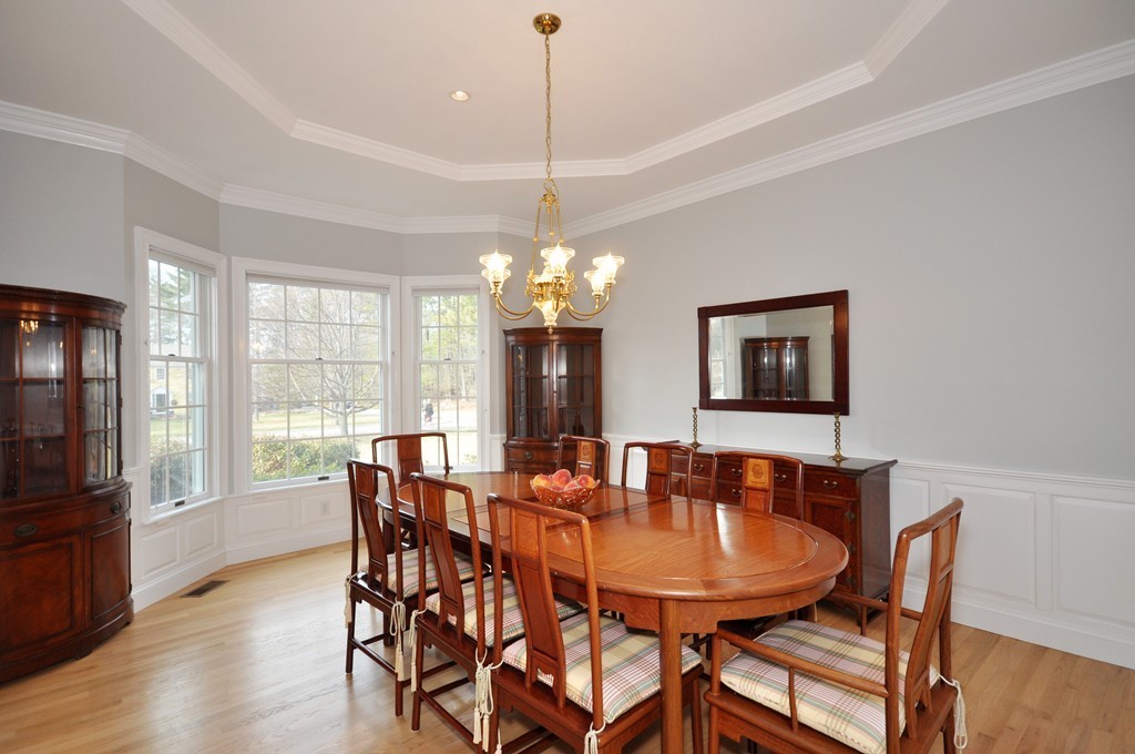 75 Channing Road Concord, MA 01742 - Photo 7 of 19 a dining room with furniture a chandelier and wooden floor