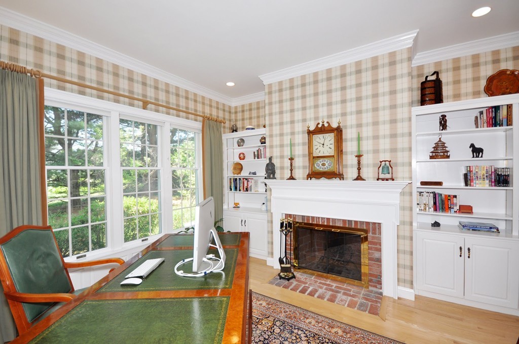 75 Channing Road Concord, MA 01742 - Photo 9 of 19 a living room with furniture a flat screen tv and a fireplace