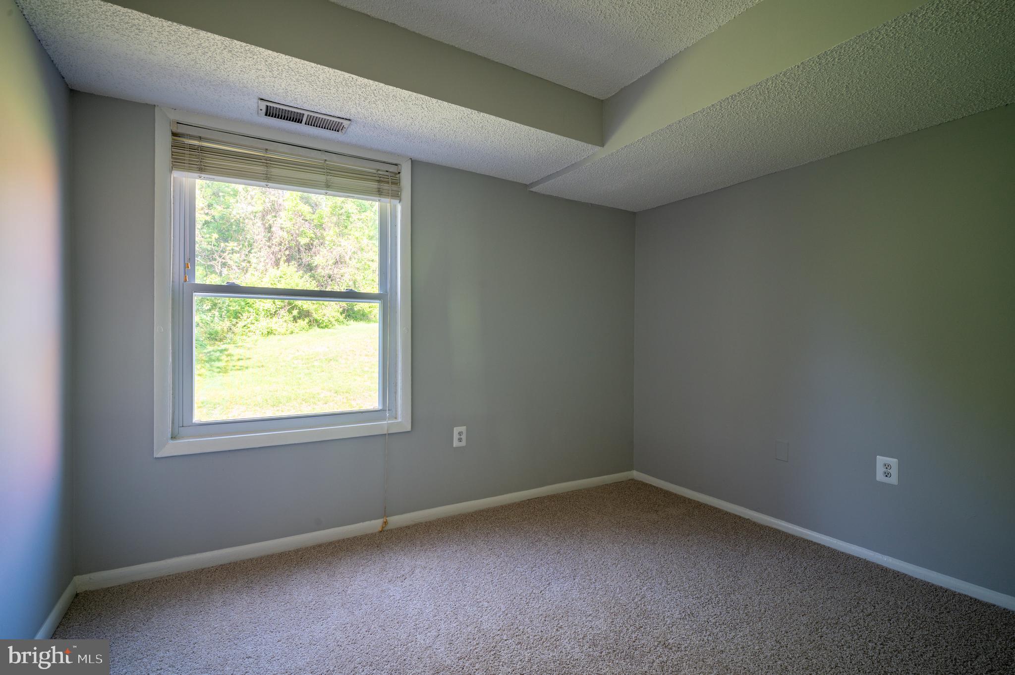3815 Swann Road, Unit 103 Suitland, MD 20746 - Photo 12 of 23 an empty room with a window