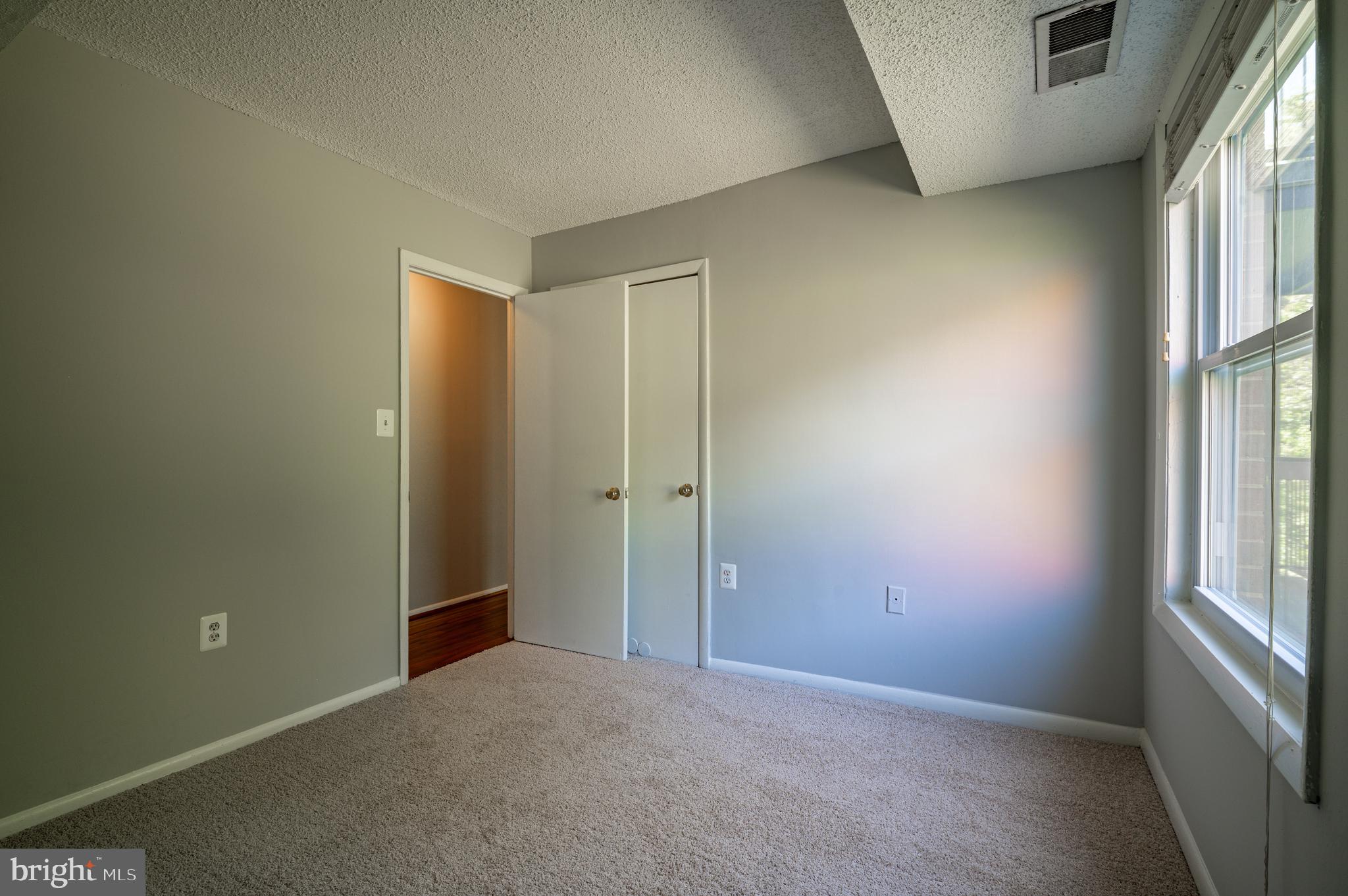 3815 Swann Road, Unit 103 Suitland, MD 20746 - Photo 13 of 23 an empty room with windows