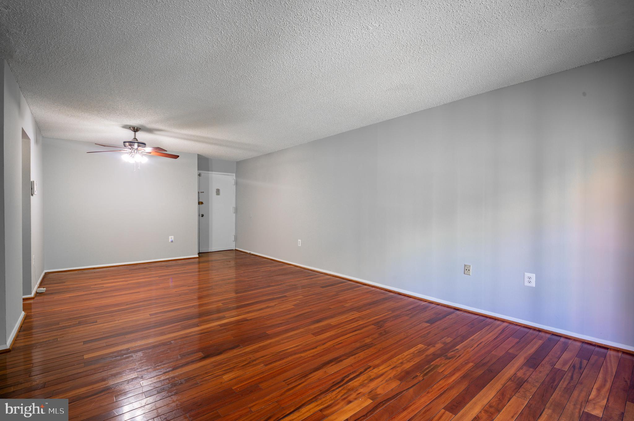 3815 Swann Road, Unit 103 Suitland, MD 20746 - Photo 5 of 23 a view of empty room with wooden floor