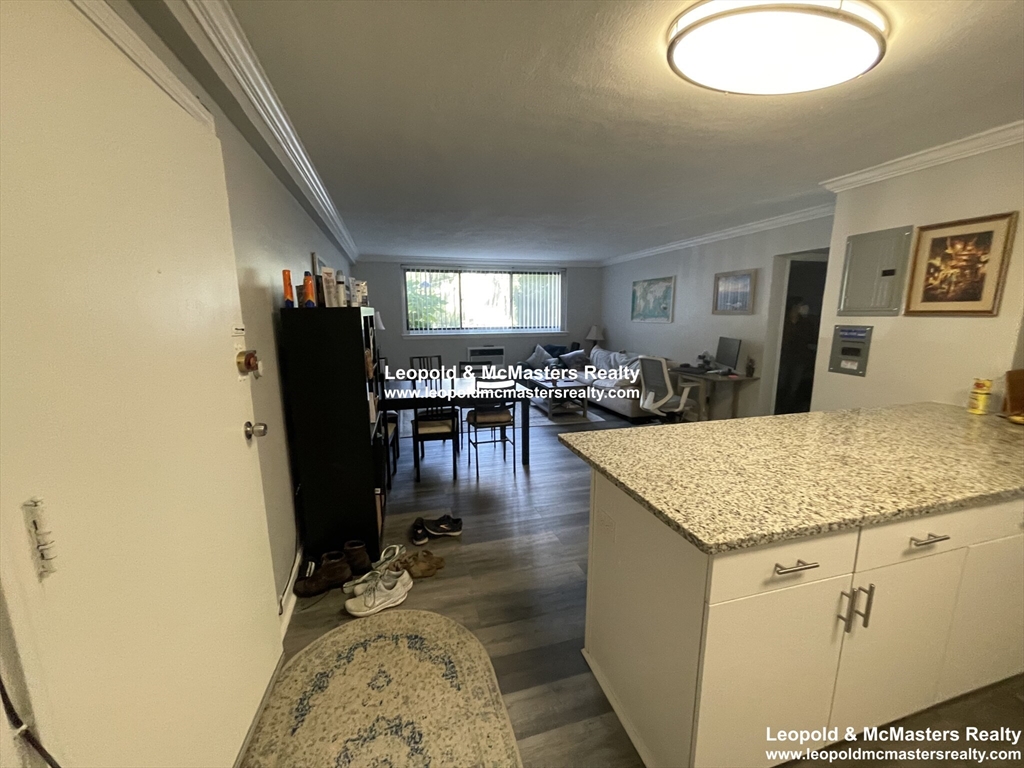 519 Washington Street, Unit 0A Brookline, MA 02446 - Photo 2 of 9 a kitchen with sink and refrigerator