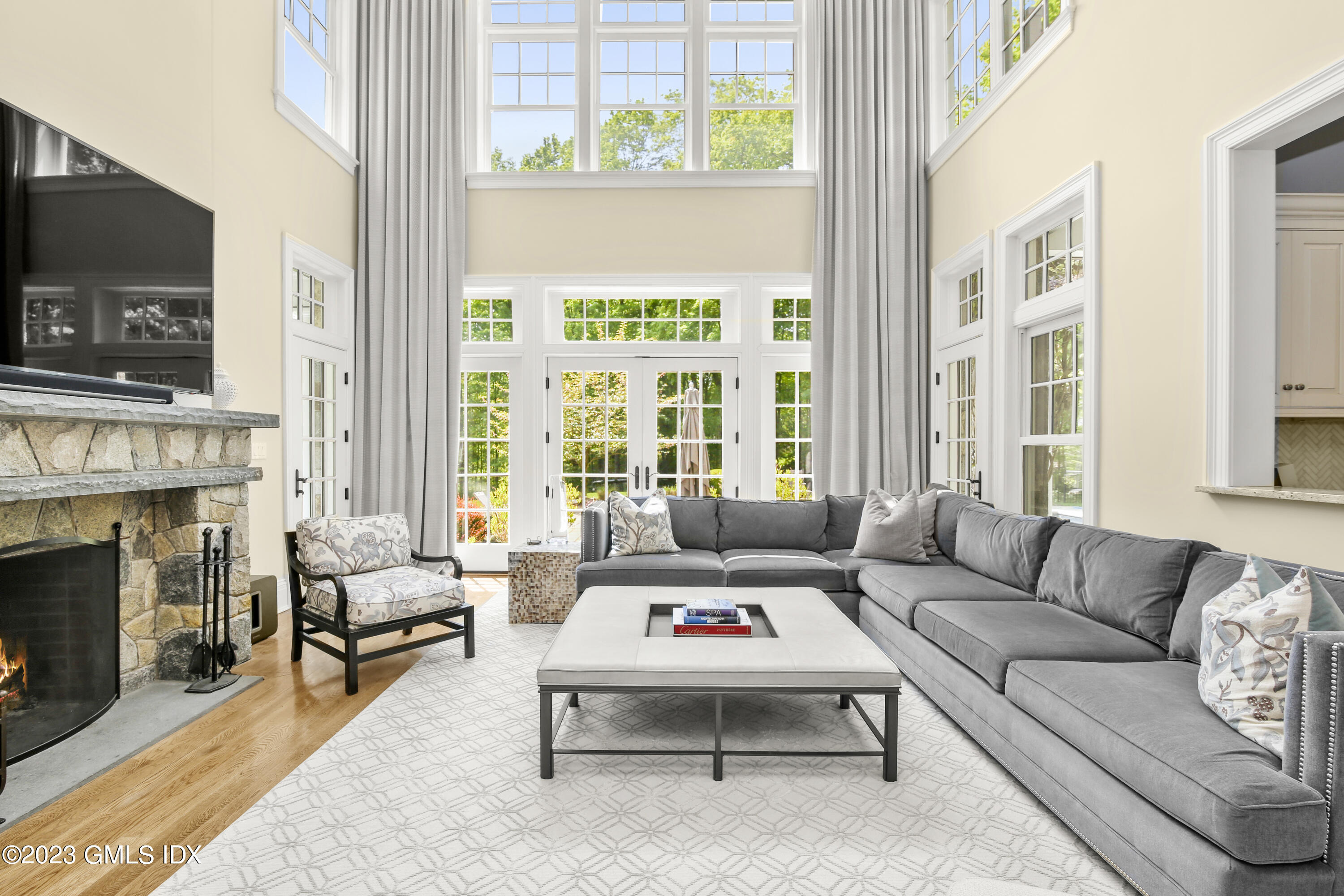 39 Boulder Brook Road Greenwich, CT 06830 - Photo 12 of 55 a living room with furniture a flat screen tv and a fireplace