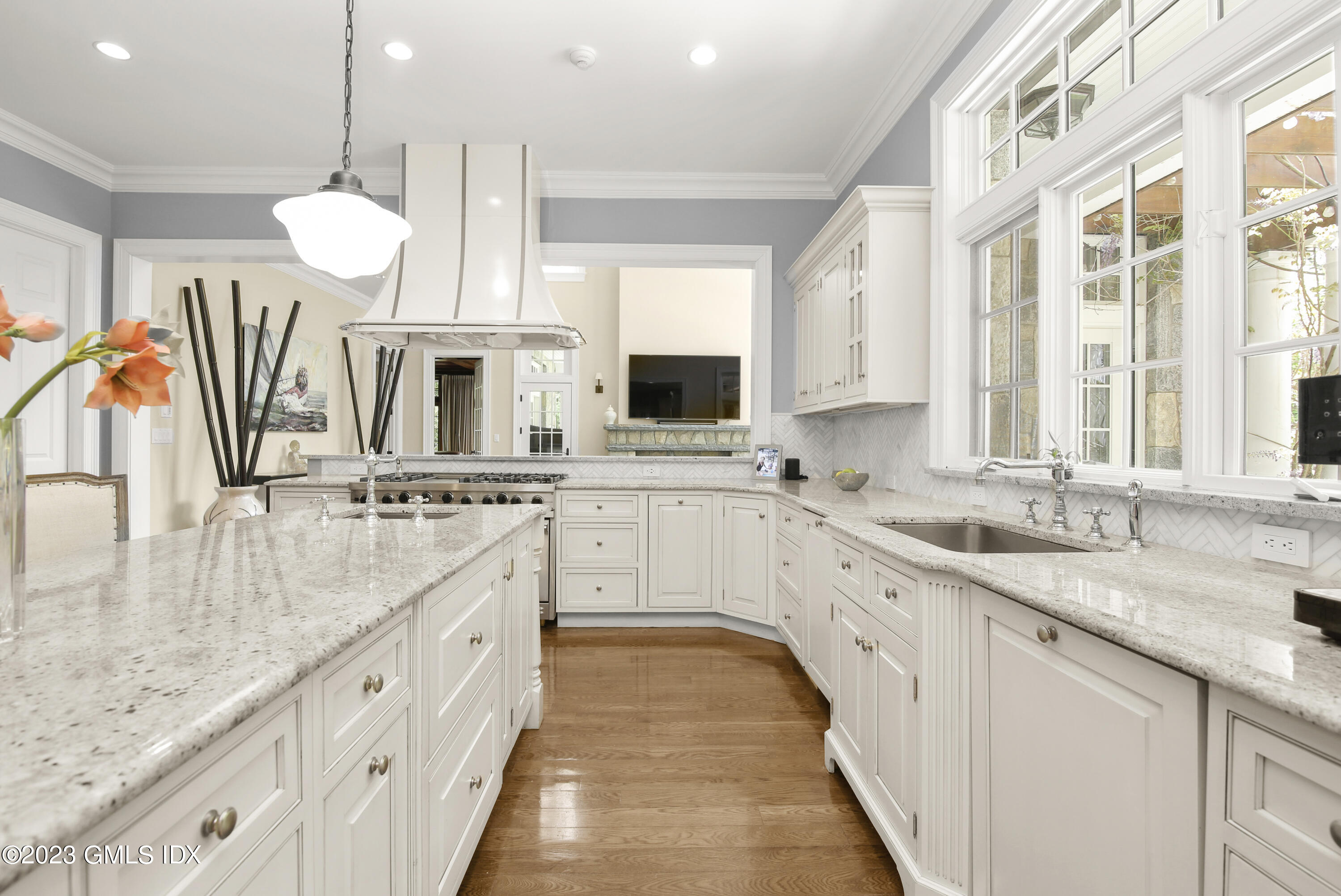 39 Boulder Brook Road Greenwich, CT 06830 - Photo 18 of 55 a large white kitchen with a lot of counter space and a sink