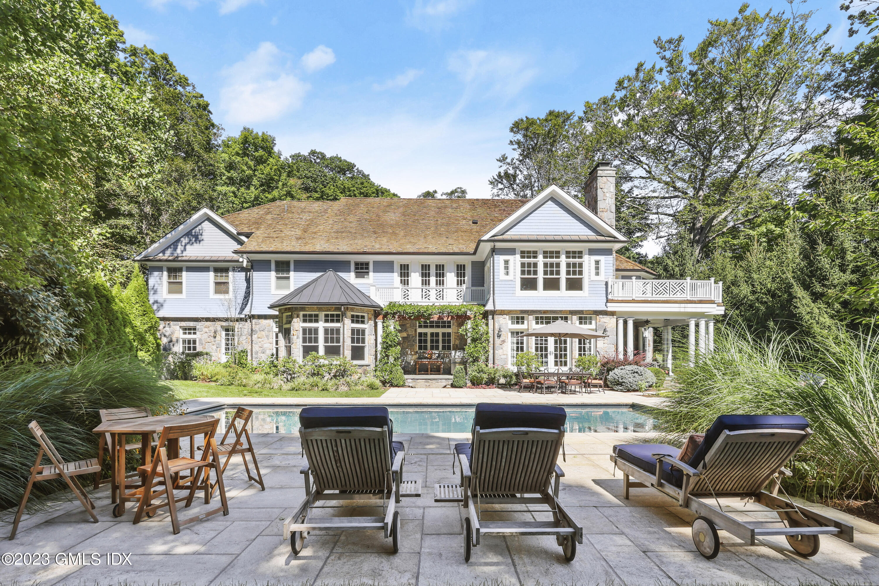 39 Boulder Brook Road Greenwich, CT 06830 - Photo 2 of 55 a view of a chairs and table in a patio