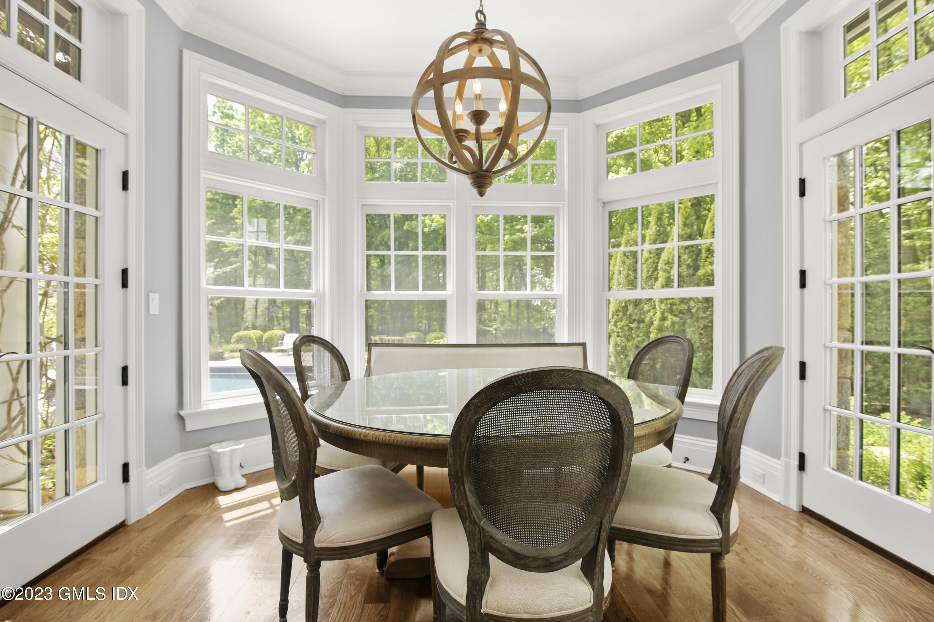 39 Boulder Brook Road Greenwich, CT 06830 - Photo 22 of 55 a view of a dining room with furniture window and wooden floor