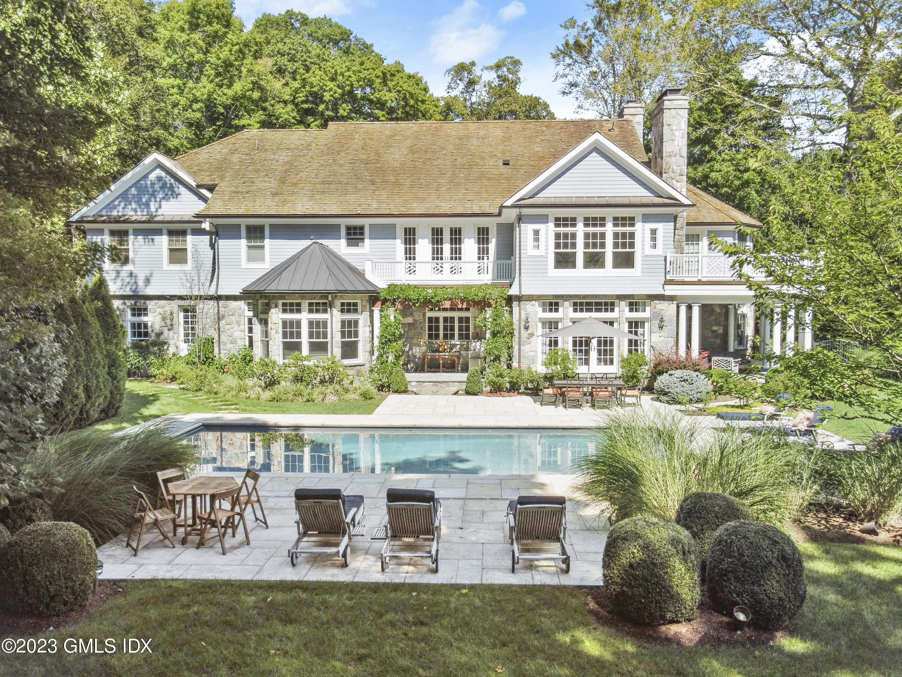 39 Boulder Brook Road Greenwich, CT 06830 - Photo 36 of 55 a front view of a residential houses with yard