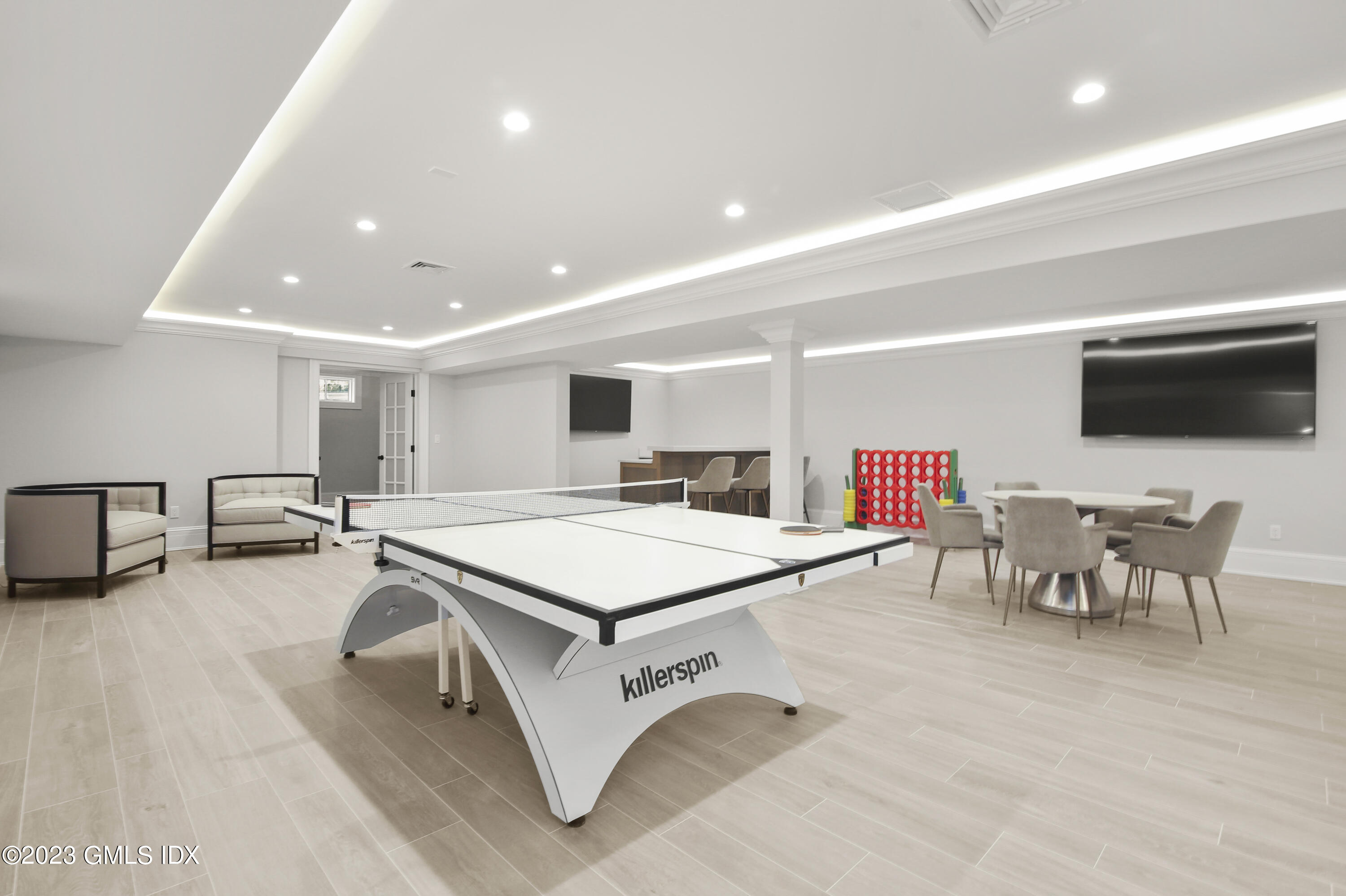 39 Boulder Brook Road Greenwich, CT 06830 - Photo 41 of 55 a room with furniture a flat screen tv and a table