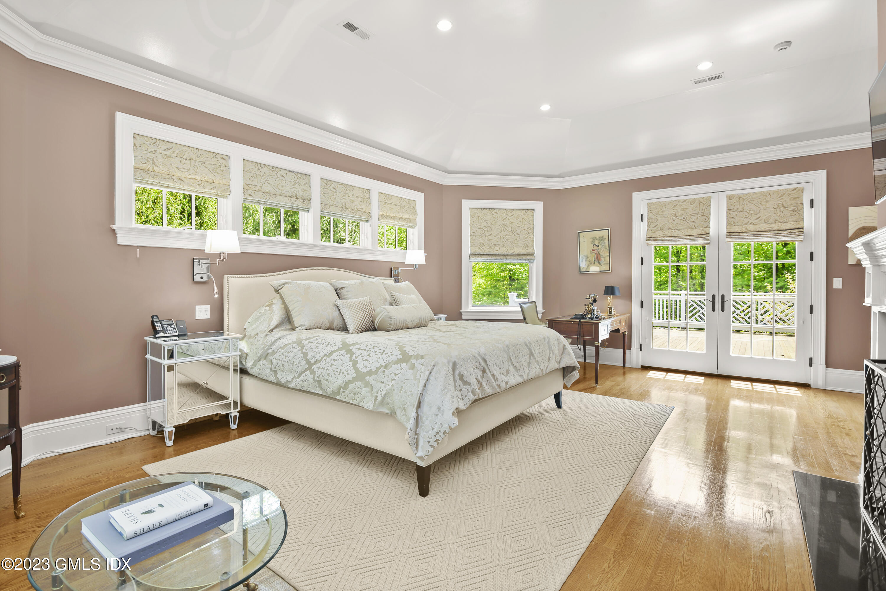 39 Boulder Brook Road Greenwich, CT 06830 - Photo 49 of 55 a spacious bedroom with a bed and a large window