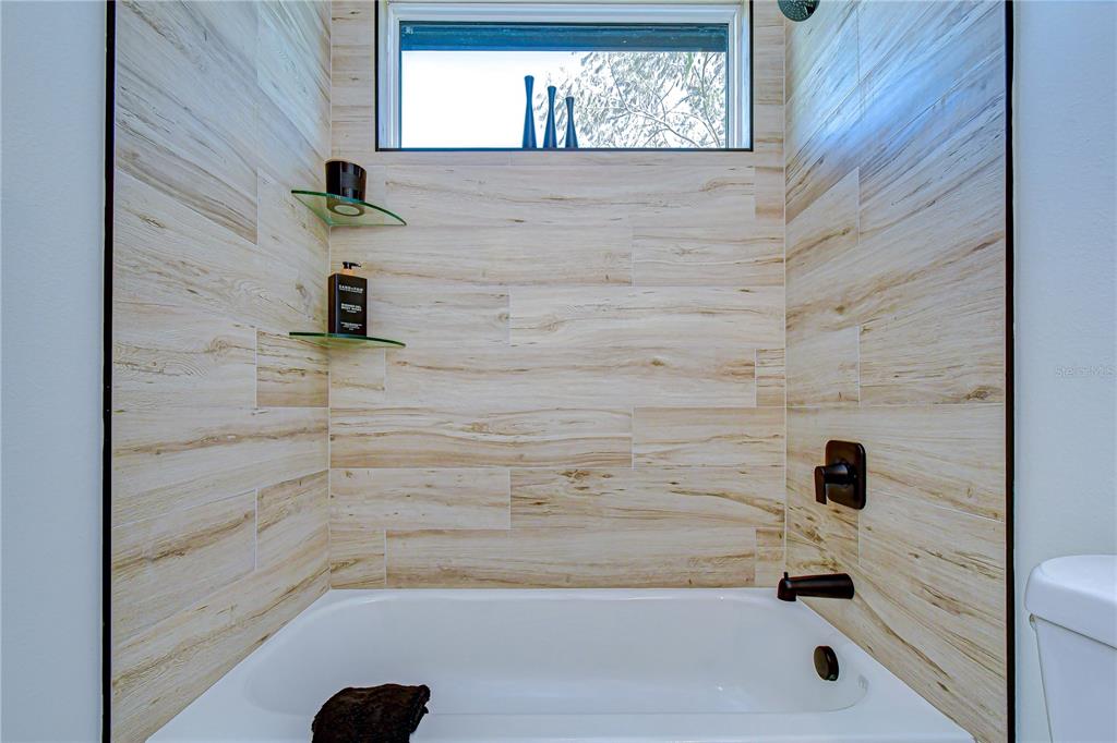 3213 West Aileen Street Tampa, FL 33607 - Photo 11 of 31 a bathroom with a bathtub