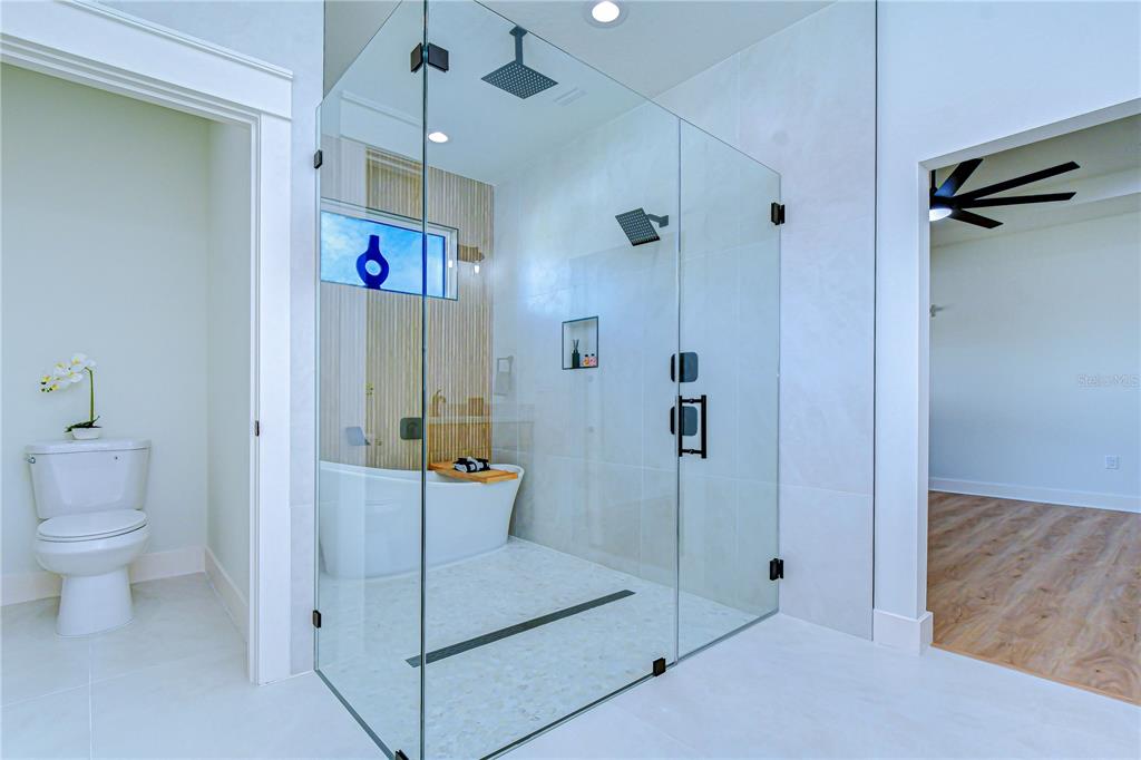 3213 West Aileen Street Tampa, FL 33607 - Photo 16 of 31 a bathroom with a shower and a toilet