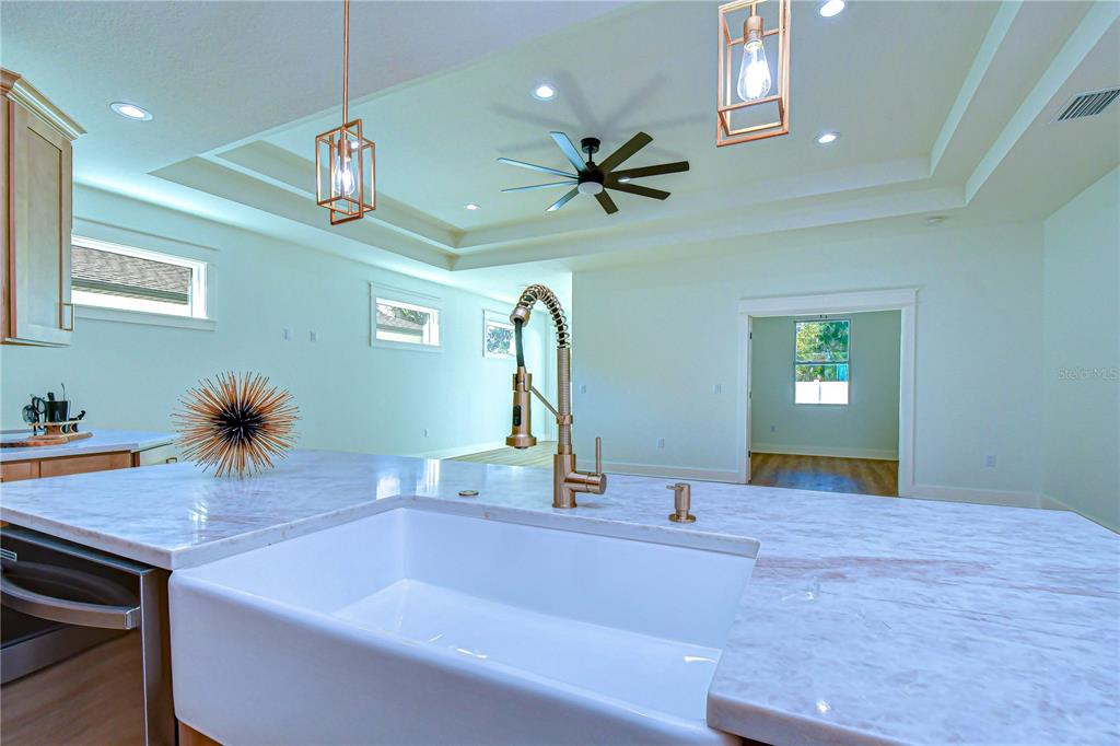 3213 West Aileen Street Tampa, FL 33607 - Photo 20 of 31 a bedroom with a bed and a chandelier