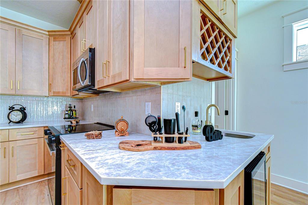 3213 West Aileen Street Tampa, FL 33607 - Photo 23 of 31 a kitchen with stainless steel appliances granite countertop a sink and cabinets