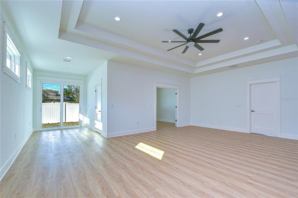 3213 West Aileen Street Tampa, FL 33607 - Photo 25 of 31 a view of empty room with wooden floor and fan