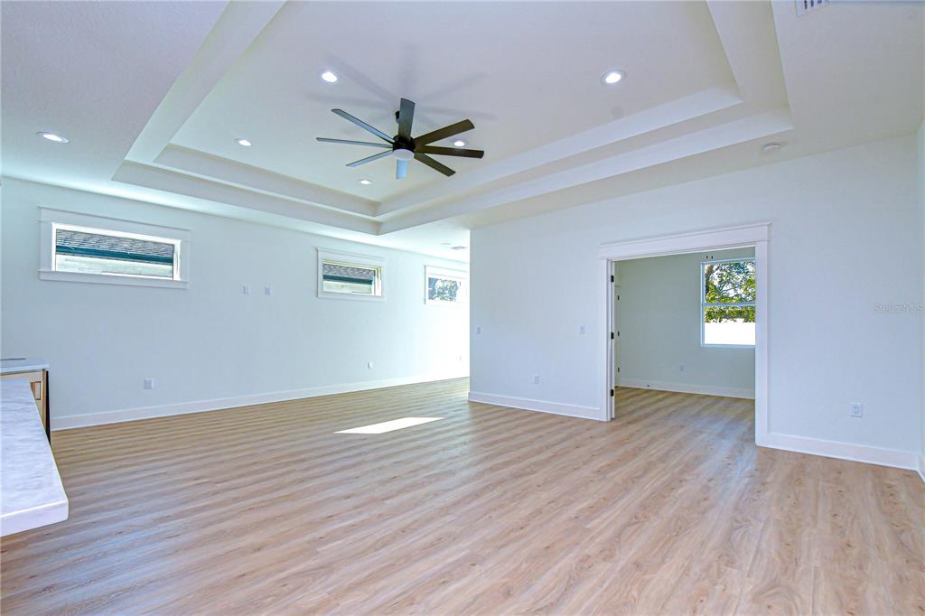 3213 West Aileen Street Tampa, FL 33607 - Photo 26 of 31 a view of empty room with wooden floor and ceiling fan