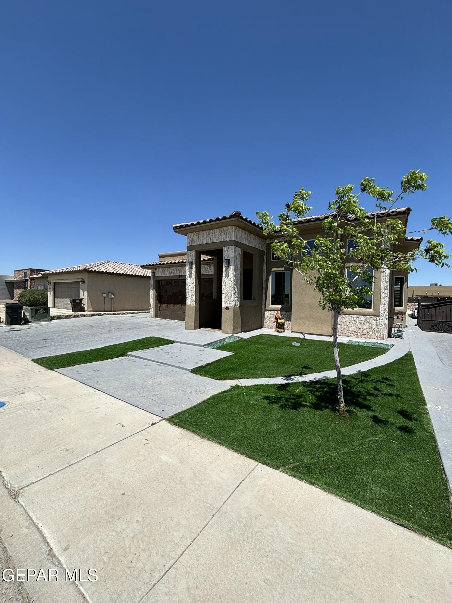317 Rio Del Rancho Court El Paso, TX 79932 - Photo 2 of 25 a view of a house with a yard