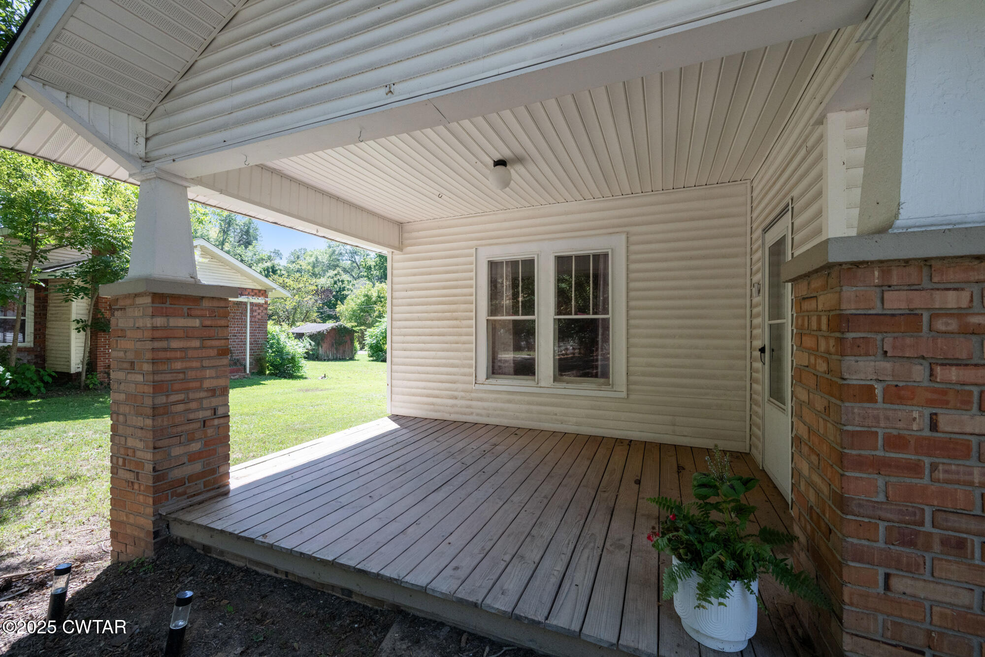 13185 Paris Street Huntingdon, TN 38344 - Photo 12 of 14 a view of backyard with porch and outdoor seating
