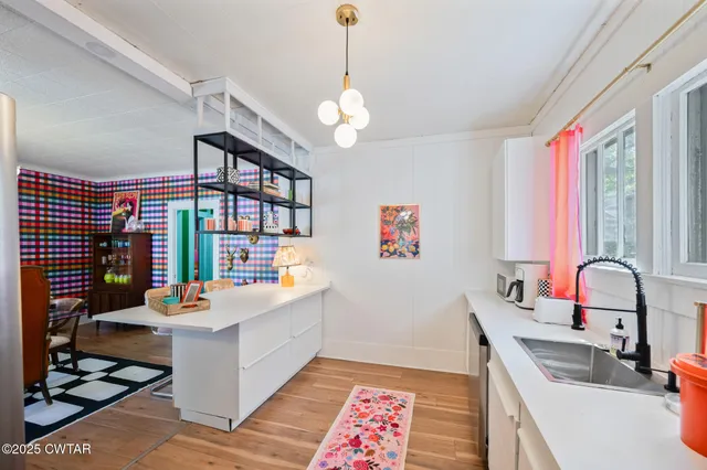 a kitchen with a stove and a sink