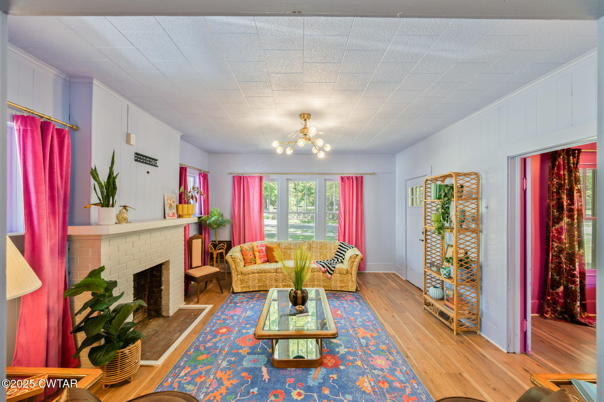 13185 Paris Street Huntingdon, TN 38344 - Photo 8 of 14 a living room with furniture fireplace and flat screen tv