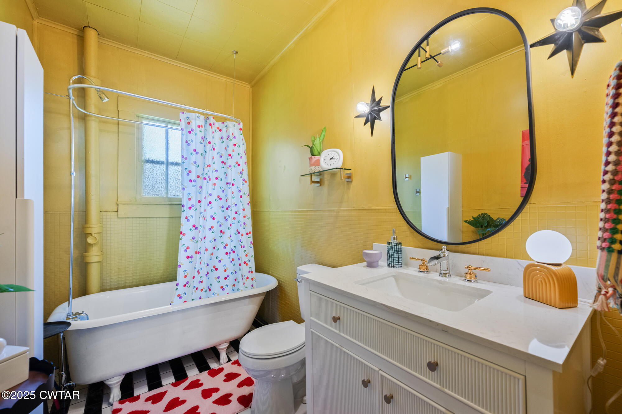 13185 Paris Street Huntingdon, TN 38344 - Photo 9 of 14 a bathroom with a sink mirror vanity and toilet