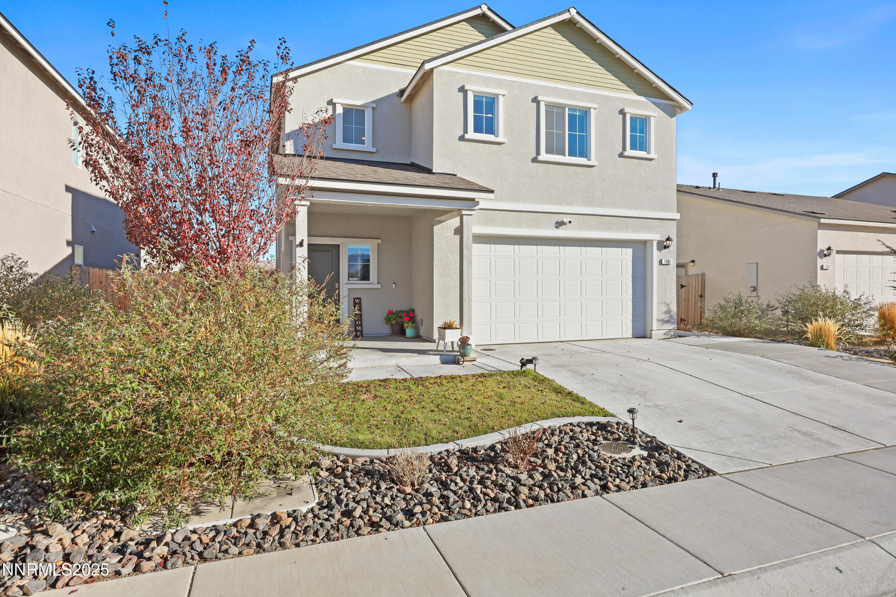 1383 Old Barn Road Sparks, NV 89436 - Photo 16 of 44 a front view of a house with garden
