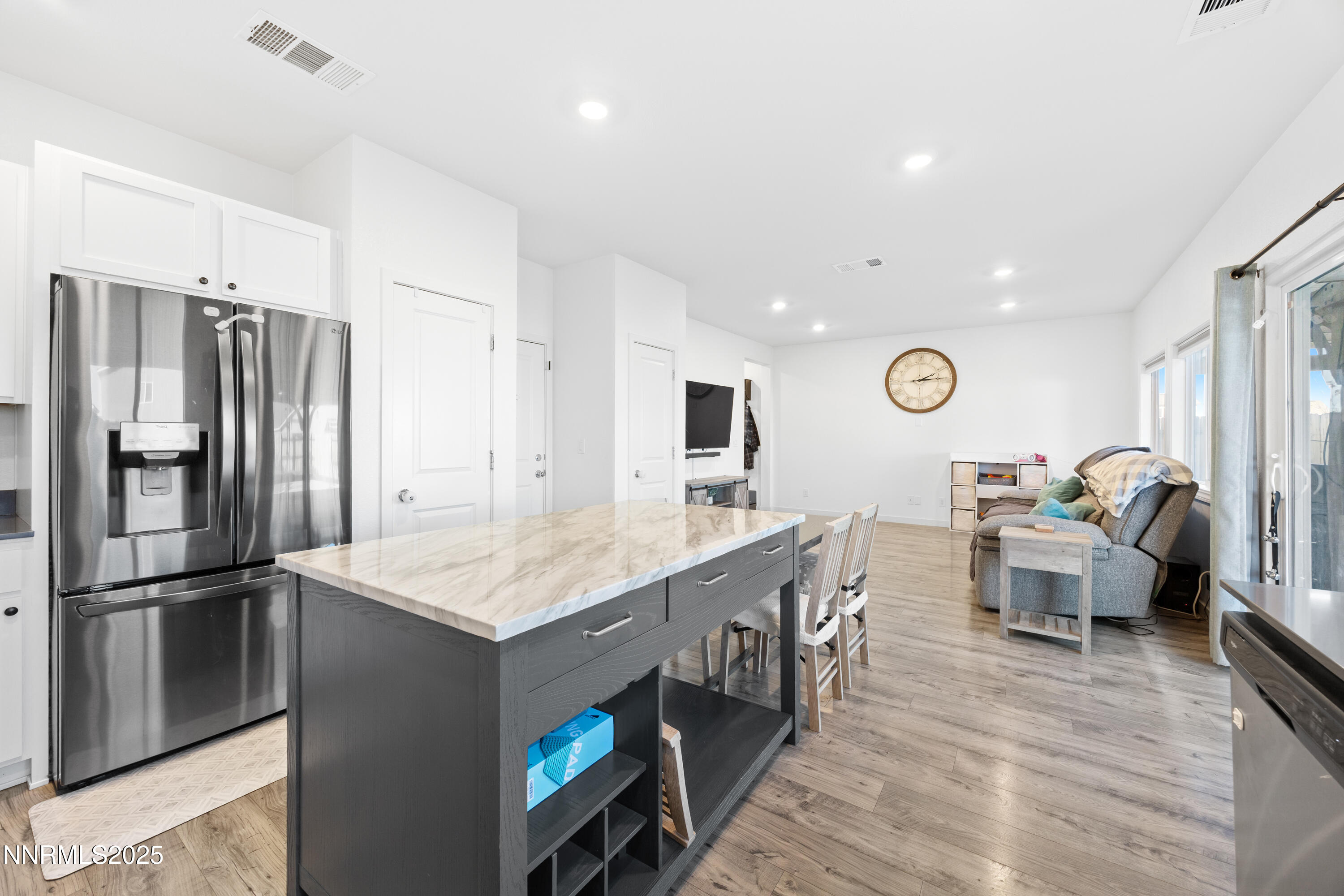 1383 Old Barn Road Sparks, NV 89436 - Photo 27 of 44 a large kitchen with stainless steel appliances granite countertop a lot of counter space and wooden floor