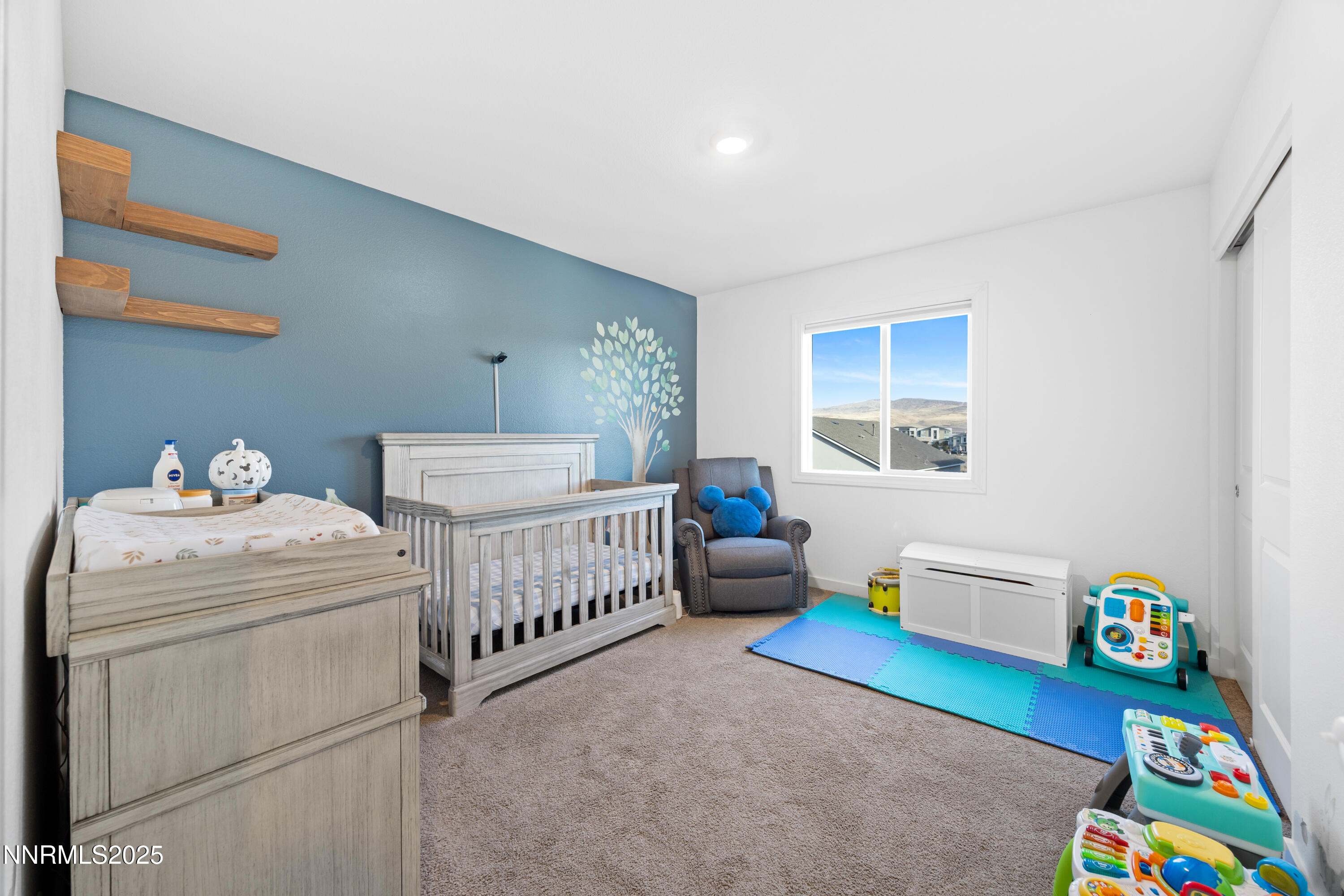 1383 Old Barn Road Sparks, NV 89436 - Photo 34 of 44 a bedroom with furniture and a wooden floor