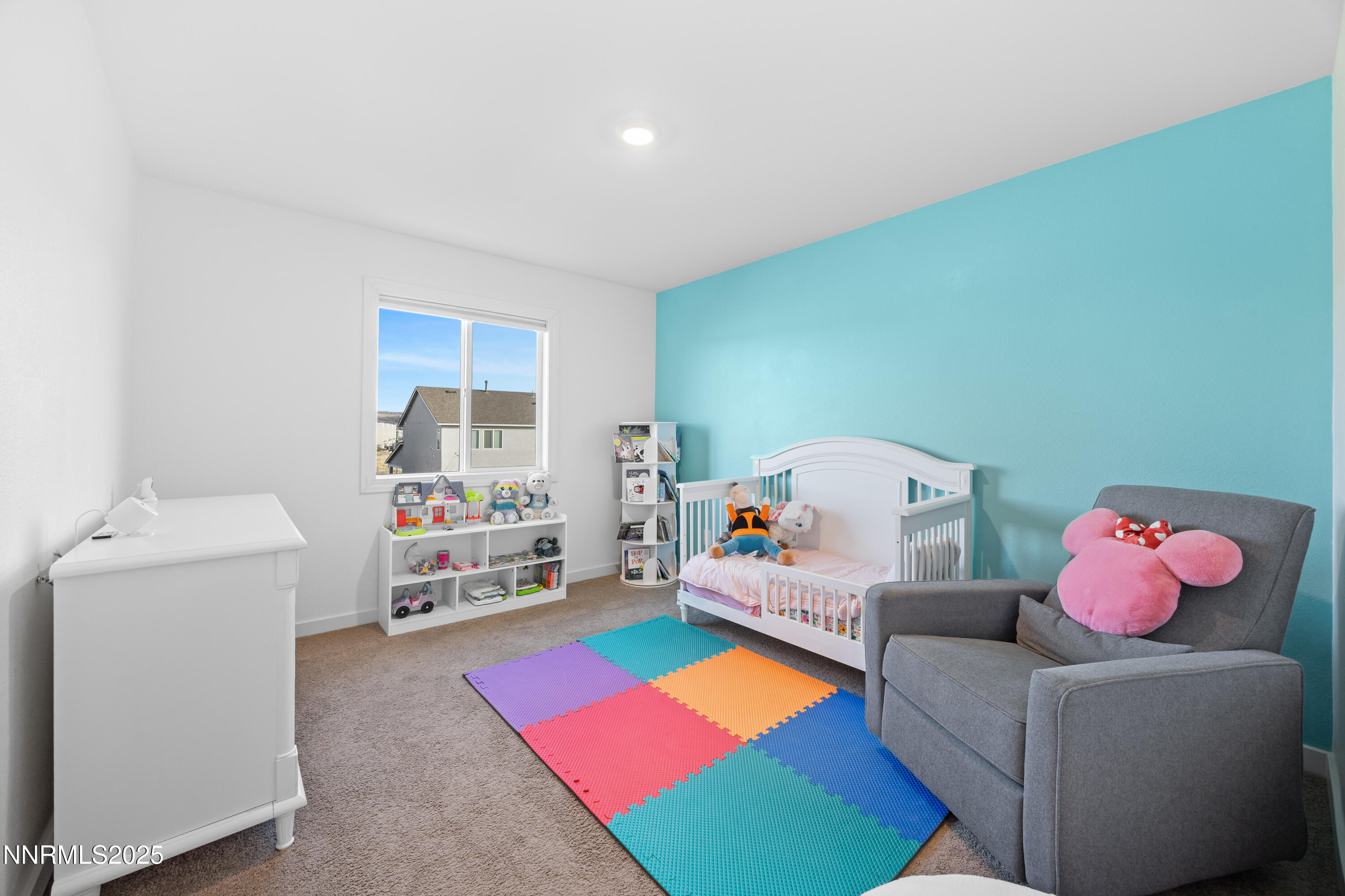 1383 Old Barn Road Sparks, NV 89436 - Photo 35 of 44 a living room with furniture and a baby crib