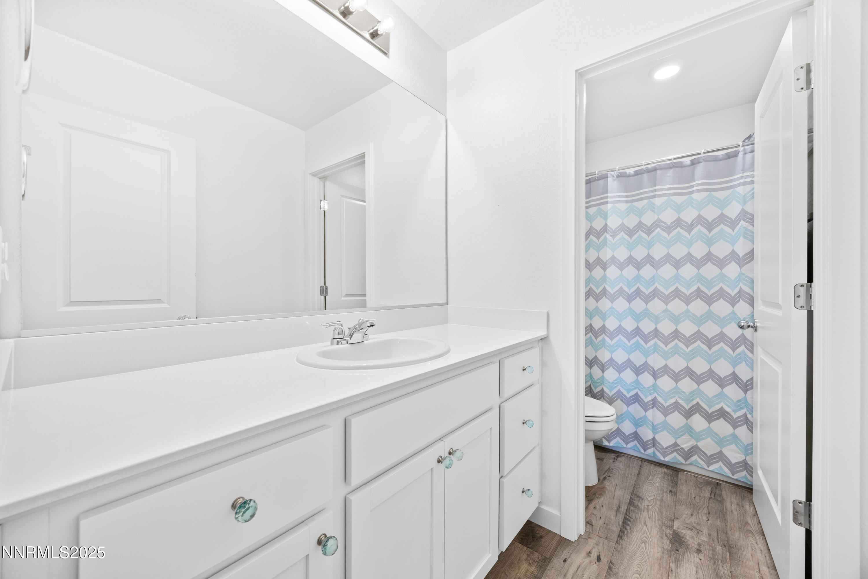 1383 Old Barn Road Sparks, NV 89436 - Photo 36 of 44 a bathroom with a sink and a mirror