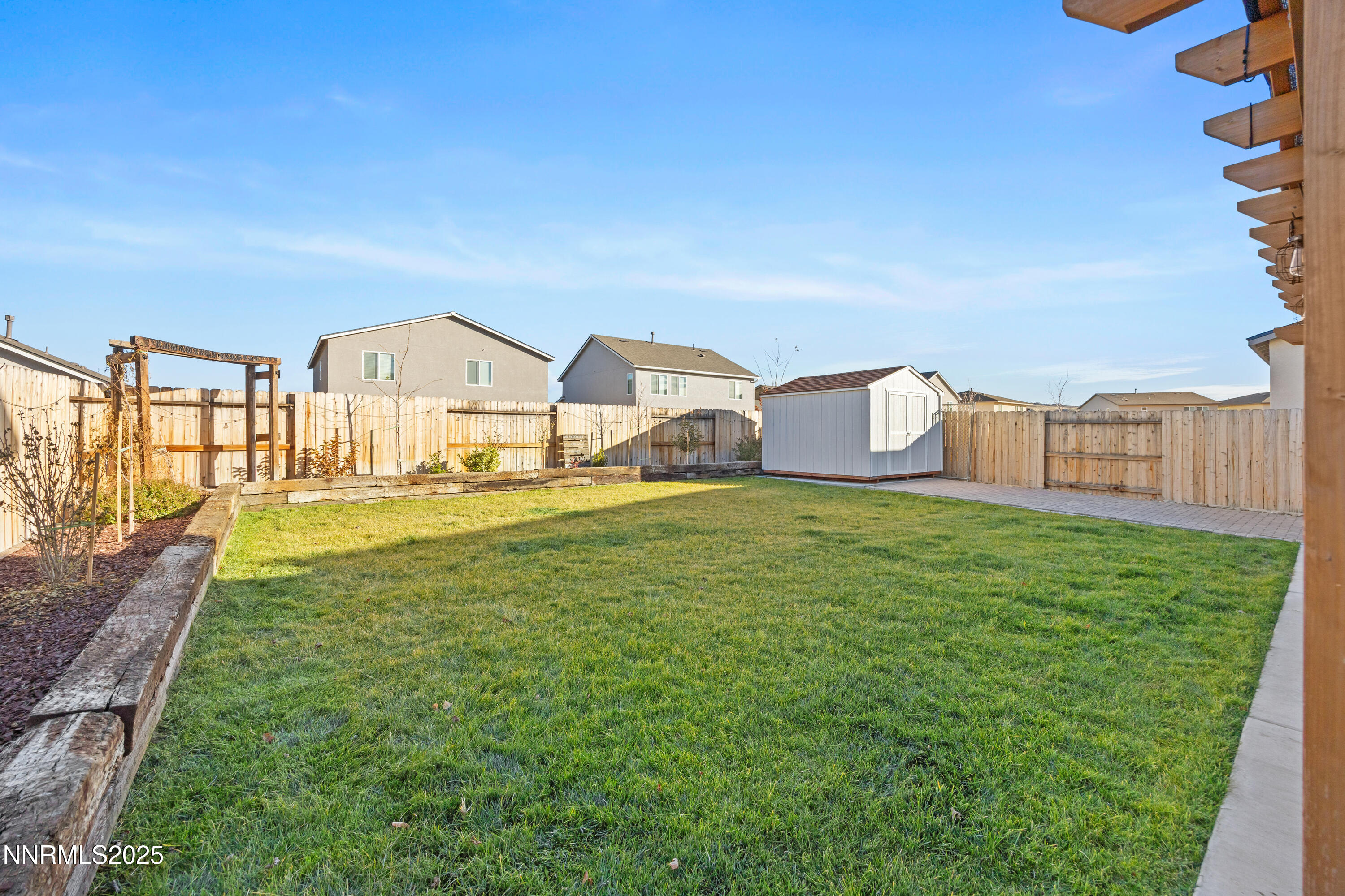1383 Old Barn Road Sparks, NV 89436 - Photo 40 of 44 a view of a house with a big yard potted plants and large tree