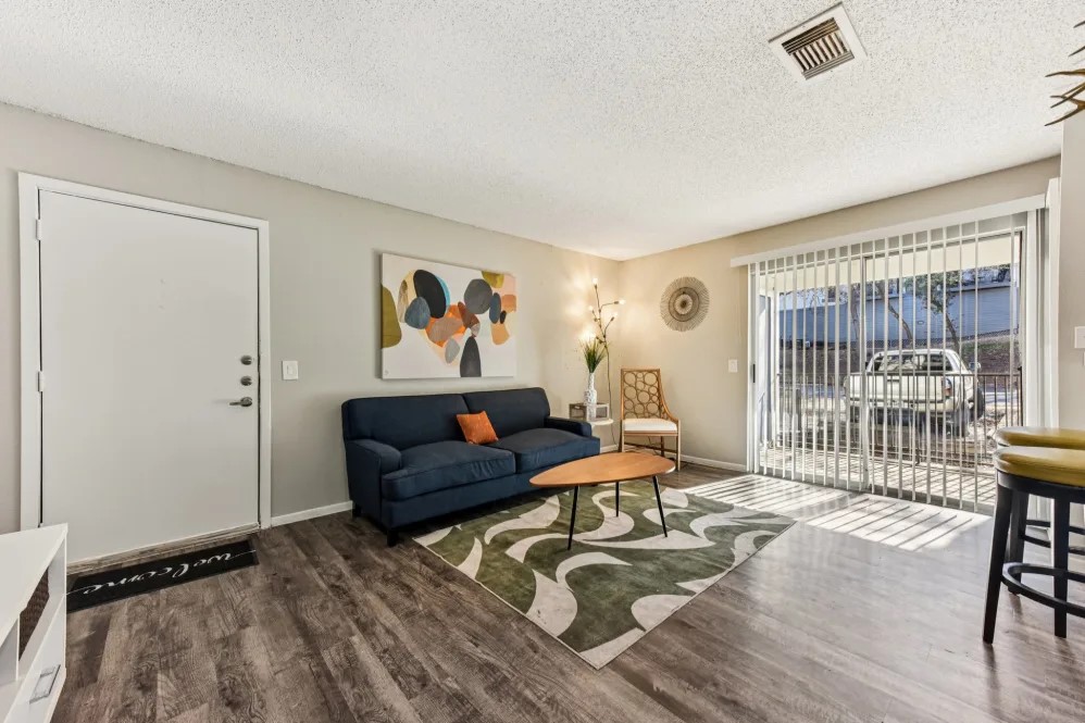 2501 Wickersham Lane, Unit 2322 Austin, TX 78741 - Photo 6 of 12 a living room with furniture and a window