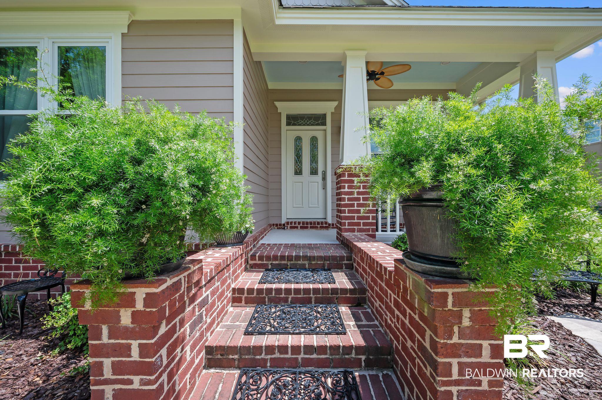 905 Buttercup Lane Foley, AL 36535 - Photo 6 of 47 Property entrance with covered porch