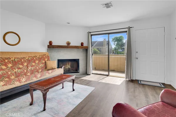 a living room with furniture rug and window