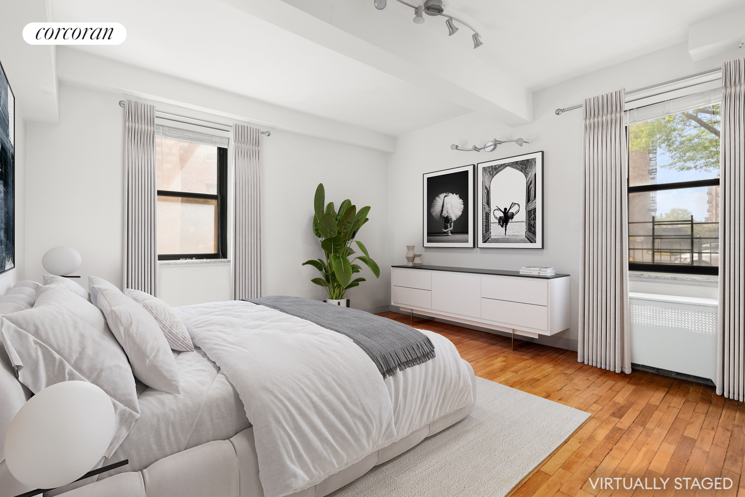 139-15 83rd Avenue, Unit 127 Queens, NY 11435 - Photo 5 of 9 a bedroom with a large bed and a window