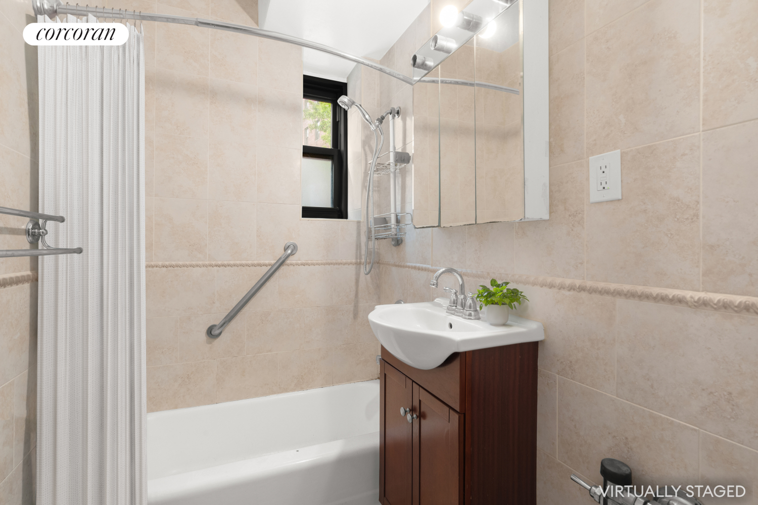 139-15 83rd Avenue, Unit 127 Queens, NY 11435 - Photo 6 of 9 a bathroom with a sink mirror and shower