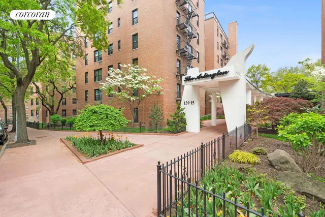 a lobby with furniture and a potted plant