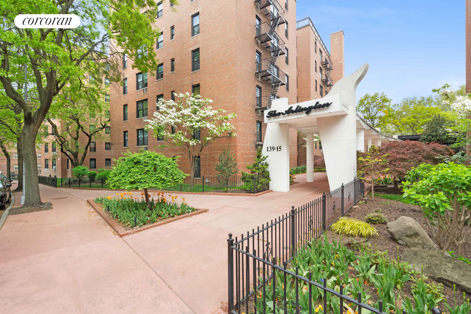 139-15 83rd Avenue, Unit 127 Queens, NY 11435 - Photo 8 of 9 front view of a house with a yard