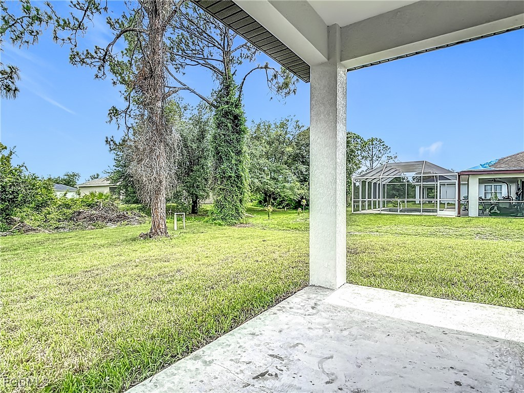 3705 8th Street Southwest Lehigh Acres, FL 33976 - Photo 27 of 34 a view of a house with a yard