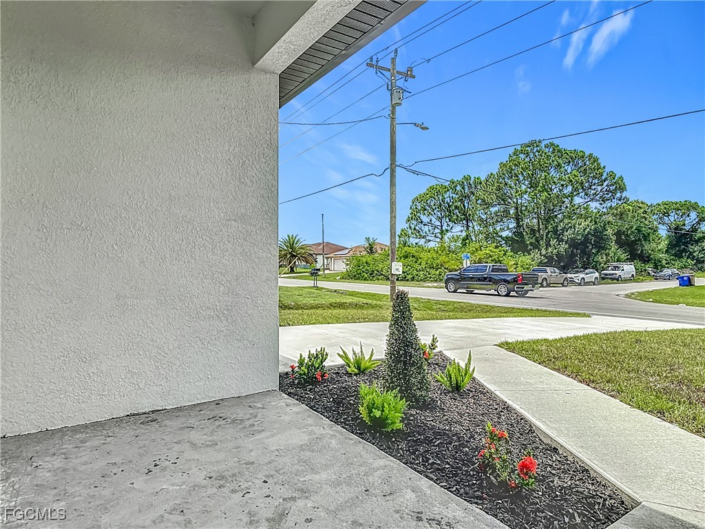 3705 8th Street Southwest Lehigh Acres, FL 33976 - Photo 3 of 34 a view of a garden with an outdoor space
